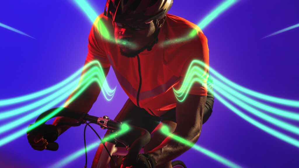 Cyclist in neon green light trails, representing dynamic movement and speed, featured in the blog post 